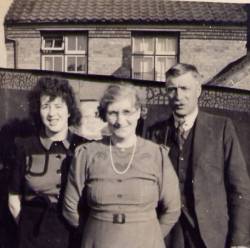 Joan Brown with her parents Evangeline and Charlie Brown