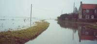 The coast road outside the old Bakery after the flood waters of the 1996 flood have withdrawn a little